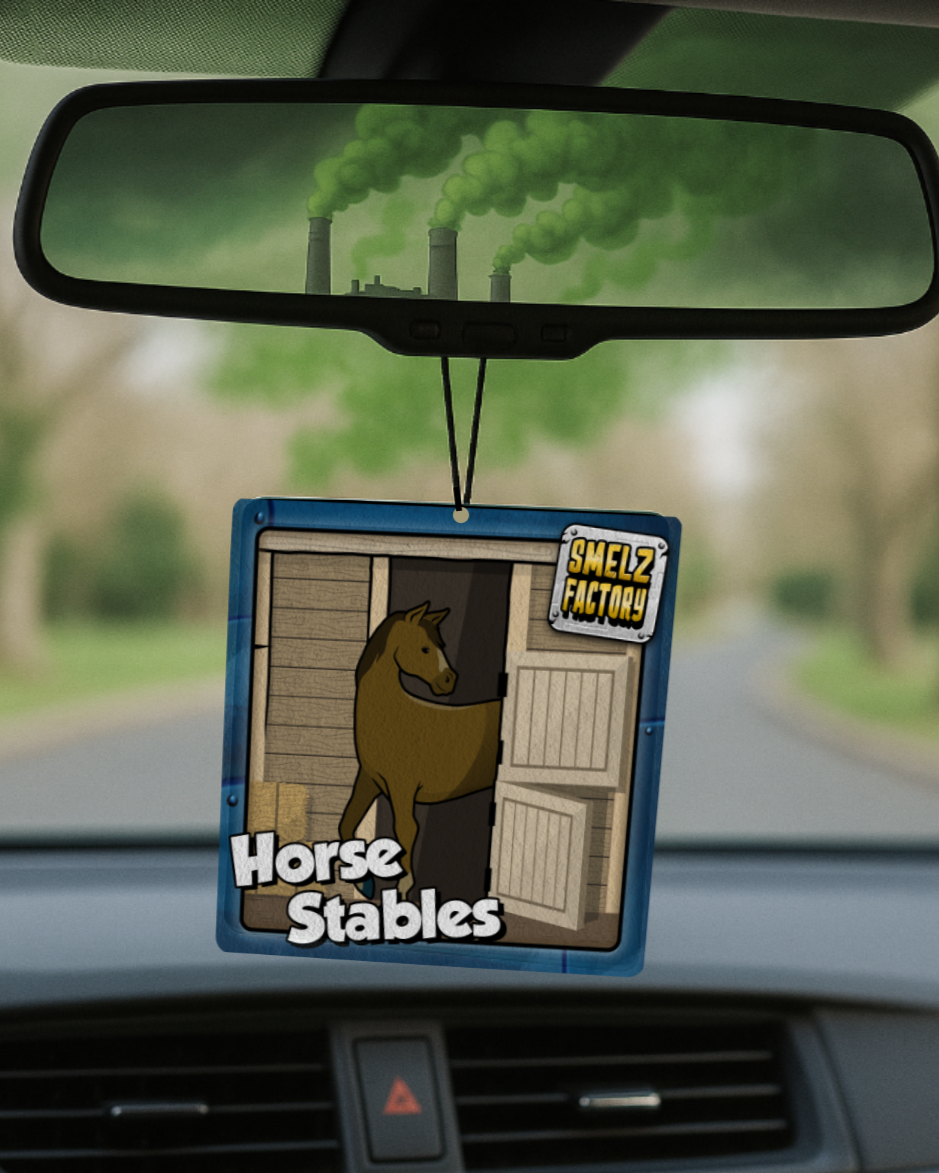 Car air freshener with horse design hanging from a car's rearview mirror.