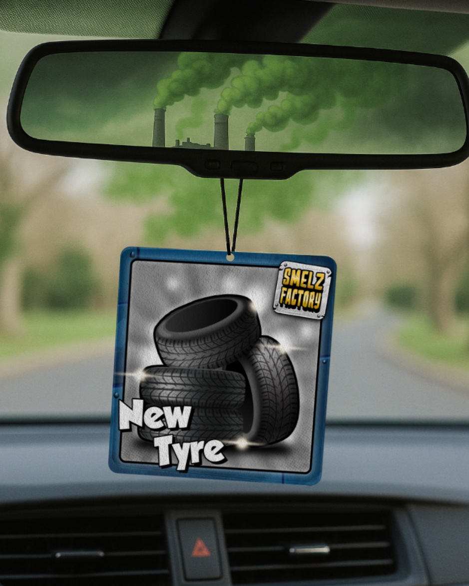 Car air freshener with tire design hanging from a rearview mirror