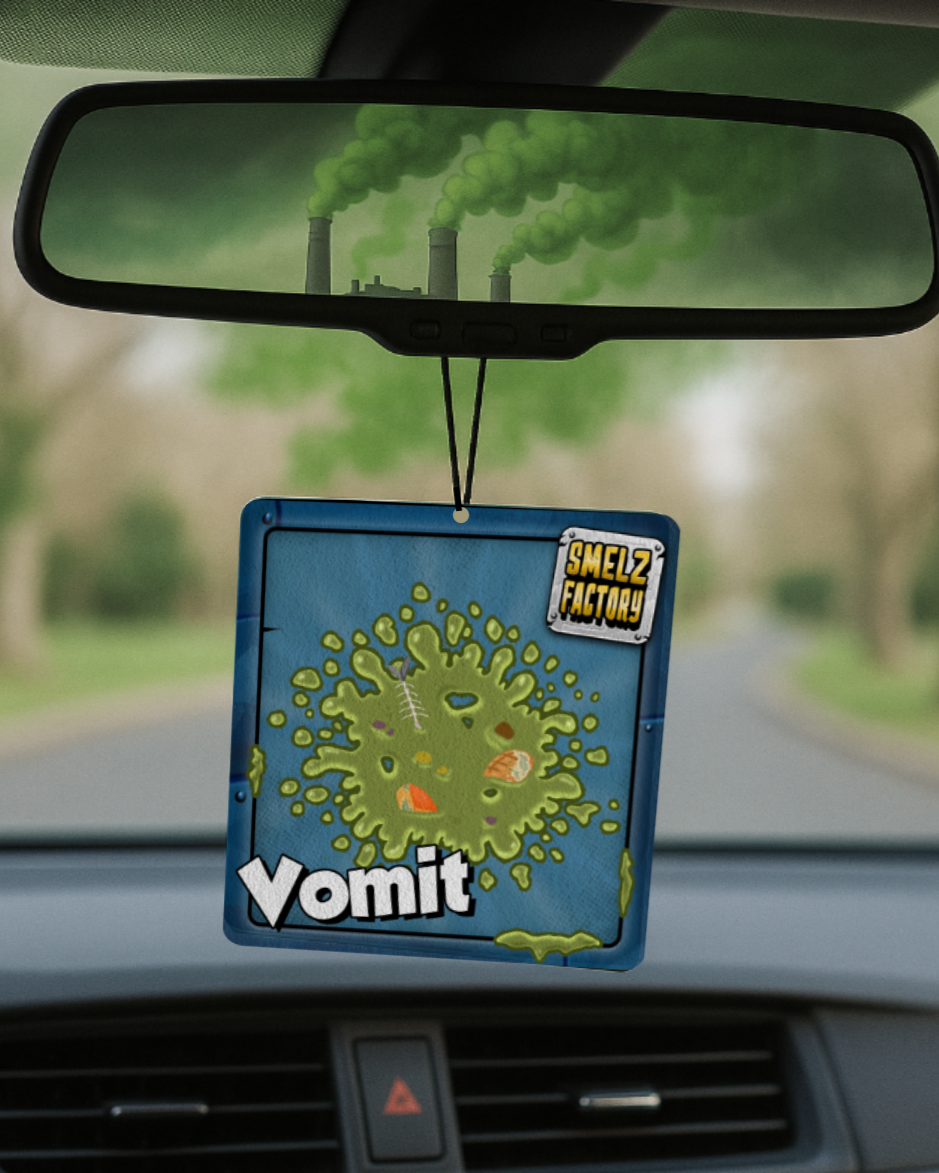 Car air freshener with 'Vomit' design hanging from a car's rearview mirror.