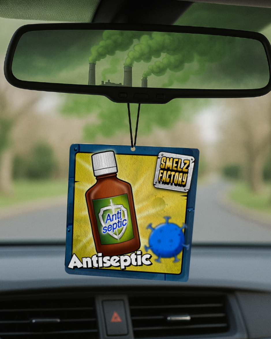Car air freshener with antiseptic theme hanging from a car's rearview mirror.